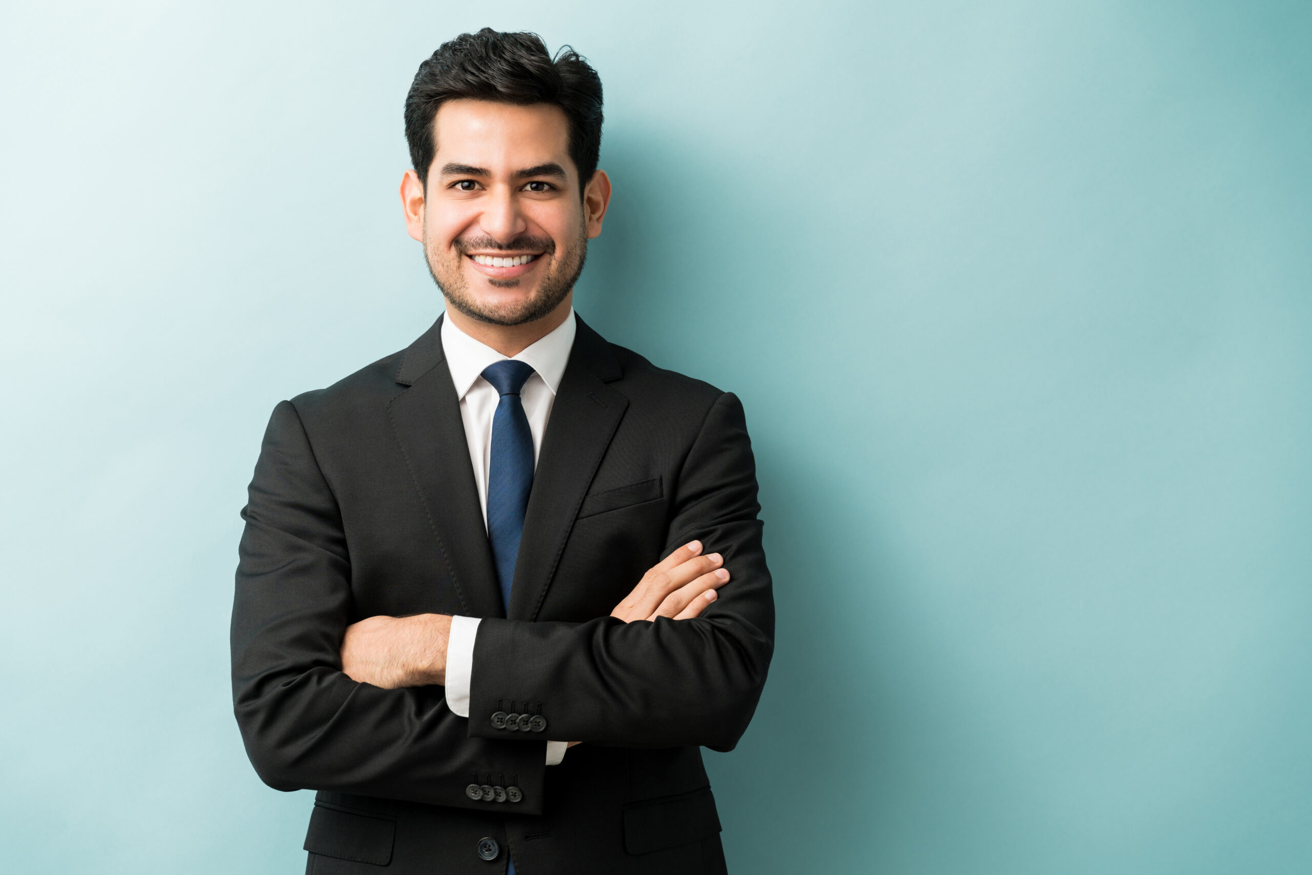 Handsome Hispanic Businessman In Black Suit Struggling with ADD or ADHD symptoms