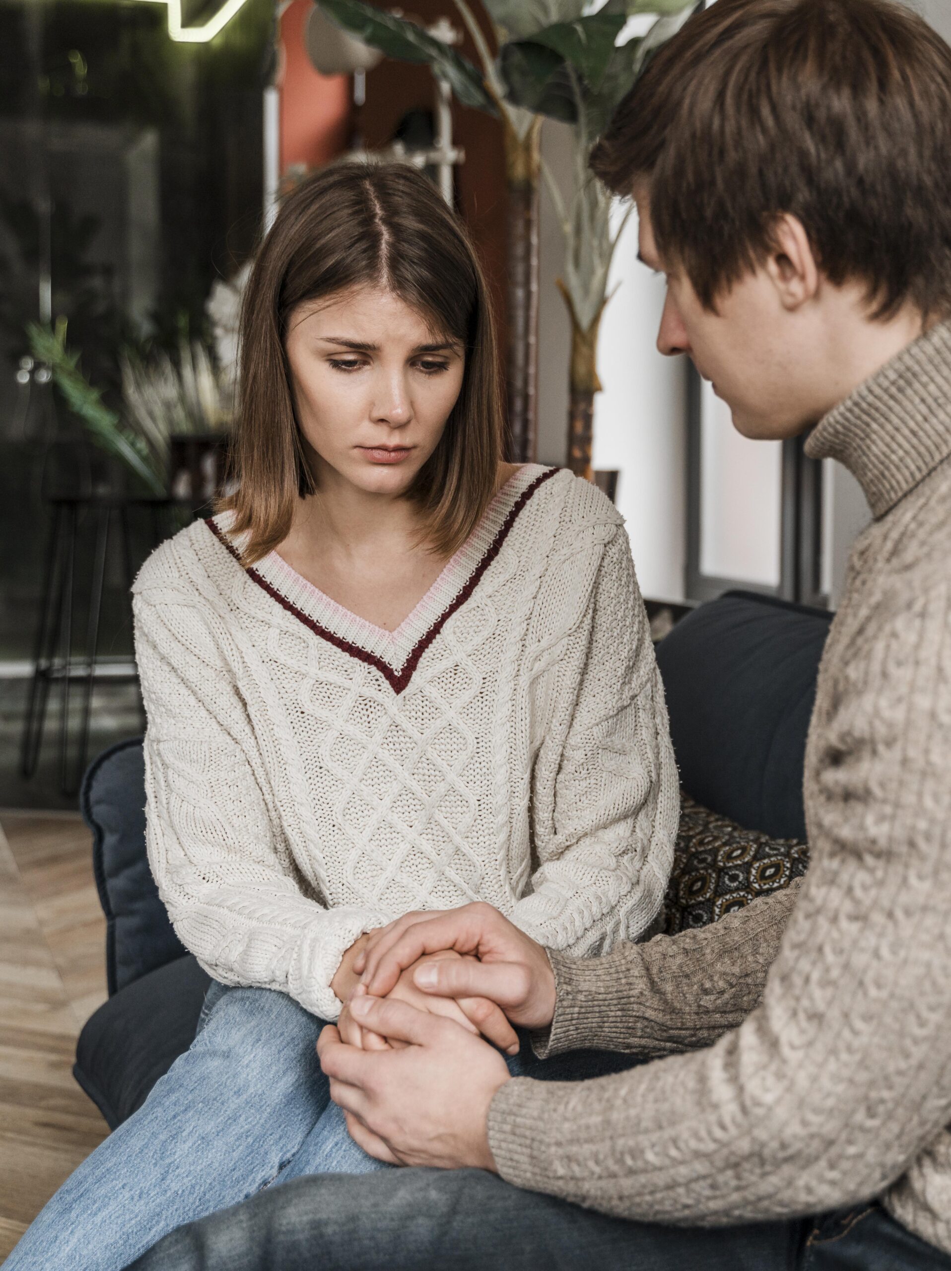 couple-holding-hands-sofa Emotional Regulation Mastery