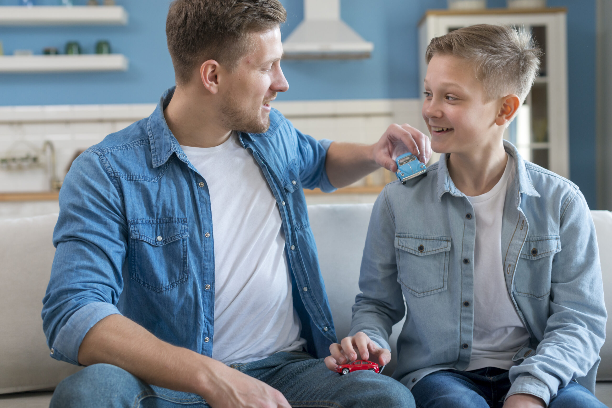father-son-playing-with-toy-cars